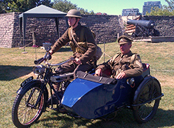 Friends of Fort York guardsman Pierce Cosgrove (left) and Fort York Program Development Officer Kevin Hebib (right), are seen on the 1917 Douglas with sidecar. Beautifully restored in the royal blue colour of The Royal Flying Corps. Photo by Ted Smolak