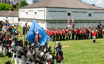 U.S. and Crown Forces reenactment units at flag-lowering ceremony during the War of 1812 Festival, Fort York National Historic Site, 15-16 June 2013. Photo: Andrew Stewart.